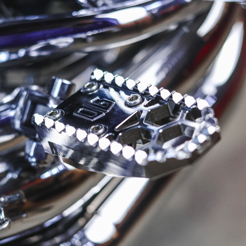 OG HoneyComp V3 Mini Foot Pegs installed on a FXR