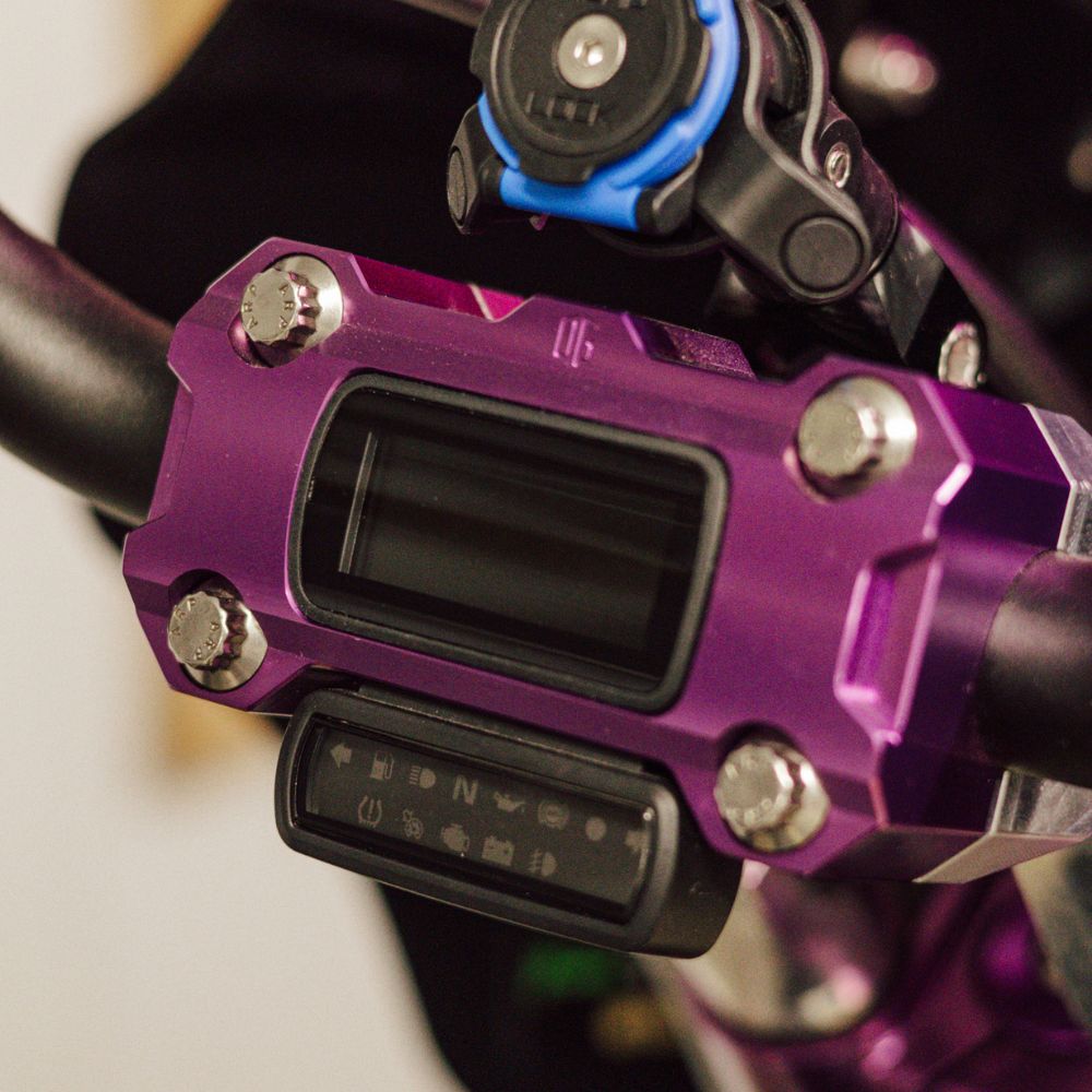 OG Purple Anodized Performance Digital Gauge Top Clamp installed on a Softail Standard 2021 with a Quad Lock Cell Phone Mount